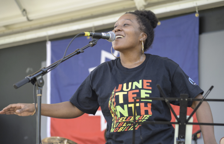A Champaign-Urbana community member taking part in last year's Juneteenth celebration. This event honors the end of slavery that took place on June 19, 1865.

Photo courtesy of The Champaign Public Library